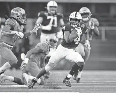  ?? HEITMAN/USA TODAY SPORTS TIM ?? Penn State running back Journey Brown carries against Memphis in the Cotton Bowl on Saturday in Arlington, Texas.