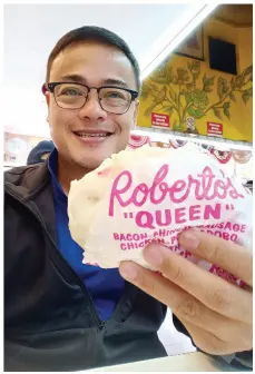  ??  ?? ENJOYING my Roberto’s Queen Siopao fix