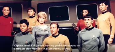  ?? ?? Captain James Kirk (centre, wearing gold) is surrounded by Enterprise crew members in a scene from Star Trek.