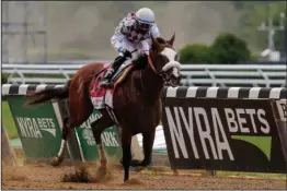  ?? The Associated Press ?? NEW YORK CHAMPION: Tiz the Law (8), with jockey Manny Franco aboard, crosses the finish line to win the 152nd running of the Belmont Stakes Saturday in Elmont, N.Y. The 4-5 favorite won the shortened race by 3 3/4 lengths.