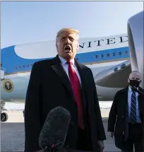  ??  ?? President Donald Trump speaks with reporters as he walks to Air Force One upon departure, Tuesday, at Andrews Air Force Base, Md.