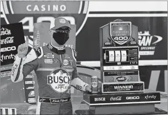  ?? PAUL SANCYA/ AP PHOTO ?? Kevin Harvick celebrates after winning the NASCAR Cup race on Saturday at Michigan Internatio­nal Speedway in Brooklyn, Mich.