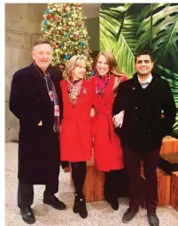  ??  ?? The author (second from right) and her stepmother in their red coats