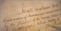  ?? Associated Press file photo ?? A detail of the 1790 Treaty of the Muscogee (Creek) Nations and the United States on display at the Smithsonia­n’s National Museum of the American Indian “Nation to Nation: Treaties Between the United States and American Indian Nations” in Washington.