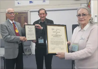  ?? Picture: PAUL CARRACHER ?? HONOURED: Horsham U3A president Rick Walker, left, presents past president Bob Mcilvena with an appreciati­on award and Helen Fleming with a life membership.