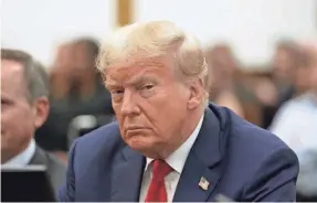  ?? POOL VIA GETTY IMAGES ?? Former President Donald Trump appears in the courtroom with his lawyers for his civil fraud trial at New York State Supreme Court. Trump has been warned about his online comments in this and other cases.