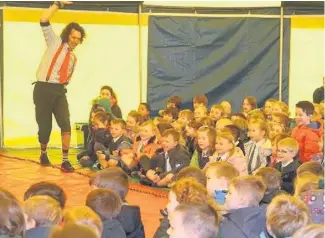  ??  ?? ●● Gawsworth Primary pupils enjoying the show from Circus Sensible