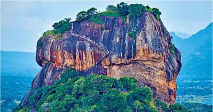  ?? ?? WONDERS: The Sigiriya rock fortress and, below, the Reclining Buddha statue in Isurumuniy­a Temple