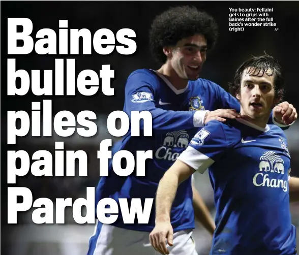  ?? AP ?? You beauty: Fellaini gets to grips with Baines after the full back’s wonder strike (right)