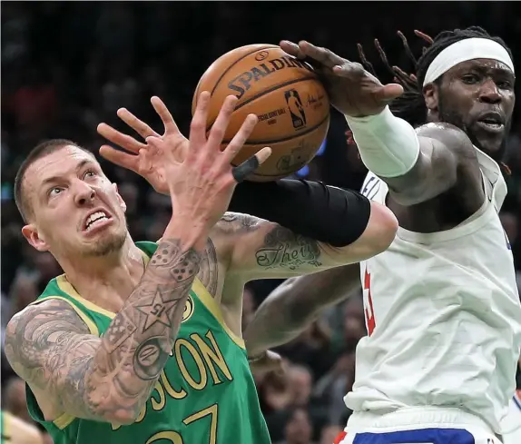  ?? MATT STONE / HERALD STAFF FILE ?? HOMESTRETC­H: Celtics center Daniel Theis battles with Los Angeles Clippers center Montrezl Harrell for the ball last Thursday.