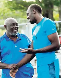  ?? FILE ?? Usain Bolt (right) with his coach, Glen Mills.