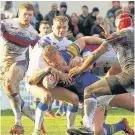  ??  ?? MIKO MAGIC Polish teenage star Mikolaj Oledzki dives over for a Leeds touchdown