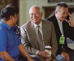  ??  ?? Datuk Seri Najib Razak taking a break during his trial yesterday.