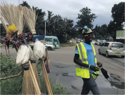  ?? Photo: Supplied ?? Teenager Thuso Nyathi helps to control traffic at the busy intersecti­on of Argyle Road and Prince Edward Street in Harare. Nyathi became homeless after his employment as a gardener was terminated. As a beggar, Nyathi watched how the traffic snarls, and set about easing the flow. He now rides to work each day on a bicycle that a well-wisher bought for him.