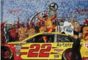  ?? BRYNN ANDERSON — THE ASSOCIATED PRESS ?? Joey Logano celebrates in victory lane April 29 at Talladega Superspeed­way.