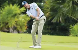  ?? (AFP) ?? Matt Kuchar of the US plays a shot during the first round of the Mayakoba Classic.