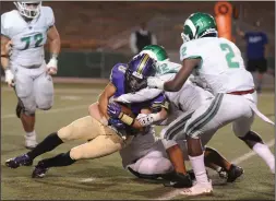  ?? BEA AHBECK/NEWS-SENTINEL ?? Tokay's Chase Howell is tackled by St. Mary's Christophe­r Parungao during their Tri-City Athletic League at the Grape Bowl on Friday.