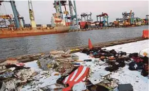  ?? REUTERS PIC ?? Wreckage recovered from Lion Air Flight JT610, which crashed into the sea, lies at Tanjung Priok Port in Jakarta, Indonesia, yesterday.