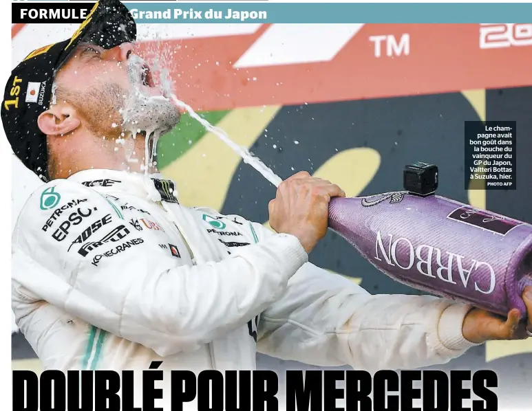  ?? PHOTO AFP ?? Le champagne avait bon goût dans la bouche du vainqueur du GP du Japon, Valtteri Bottas à Suzuka, hier.