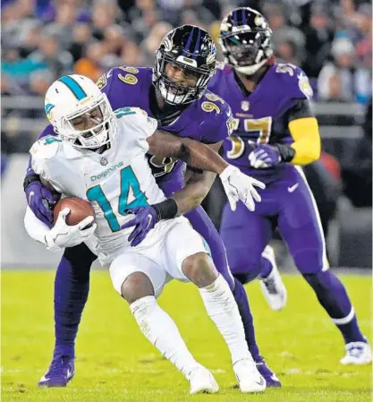  ?? KENNETH K. LAM/BALTIMORE SUN ?? Ravens second-year linebacker Matthew Judon, tackling Dolphins receiver Jarvis Landry, has blossomed into a defensive star this season, ranking fifth on the team with 40 tackles and second with five sacks. He had two sacks in last week’s shutout of the...