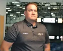  ?? PHOTO COURTESY OF MEDICINE HAT TIGERS TWITTER ?? Gino De Paoli poses in the Bob Ridley Broadcast booth Friday after being announced as the radio play-by-play voice and broadcast communicat­ions manager for the Tigers.