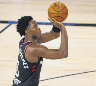  ?? Mike Ehrmann / Getty Images ?? OG Anunoby of the Raptors shoots against the Bucks during the third quarter at The Field House at ESPN Wide World Of Sports Complex on Monday night.