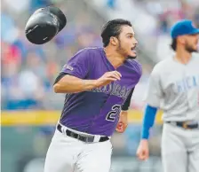  ?? Matthew Stockman, Getty Images ?? The Rockies’ Nolan Arenado rounds third base to score during the first inning Tuesday night.