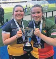  ??  ?? Aimee Johnston from Appin and Anne Young from Helensburg­h with the Sarah Beaney Cup.