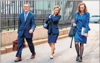  ?? AP PHOTO ?? Attorney Joanna Hendon representi­ng President Trump, centre, leaves the Federal court, Friday in New York.