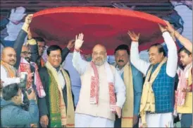  ?? PTI ?? Union minister Amit Shah was presented a traditiona­l Assamese 'japi' on Sunday.