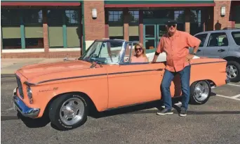  ??  ?? Krista and Bob Traynor show their 1961 Studebaker Lark convertibl­e. (Jan Wells photo)