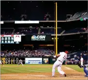  ?? MATT SLOCUM ?? Philadelph­ia Phillies' Rhys Hoskins follows through after hitting a three-run double during the seventh inning of a baseball game against the Los Angeles Dodgers, Tuesday, in Philadelph­ia. Philadelph­ia won 6-2.