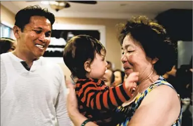  ??  ?? THE AUTHOR’S young son, Reyner Delorey, center, with Mary Hien Bui, right, and her son, Jonathan Nguyen.