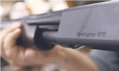  ?? AP ?? In this March 1, 2018 file photo, the Remington name is seen etched on a model 870 shotgun at Duke’s Sport Shop in New Castle, Pa. US gunmaker Remington Outdoor Company filed for bankruptcy protection, after years of falling sales and lawsuits tied to...