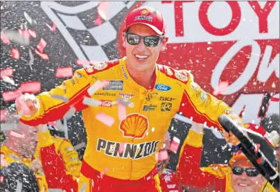  ?? AP PHOTO ?? Joey Logano celebrates after winning the NASCAR Cup Series auto race in Victory Lane at Richmond Internatio­nal Raceway in Richmond, Va., Sunday.