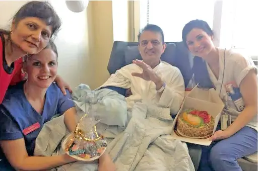  ??  ?? HAPPY BIRTHDAY, ANGEL: Anni Hindocha’s parents Vinod and Nilam are smiling with two nurses as they pose with a birthday cake on a Facebook picture.