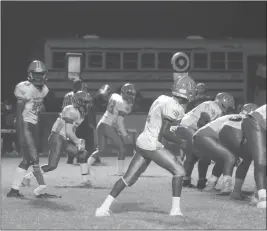  ??  ?? Westlake High School junior quarterbac­k Gary Boykin looks to the sideline for a play from the coaches late in the fourth quarter of Friday’s game at Lackey, a 38-14 Wolverines win. Boykin, who has an artificial right lower leg, guided the Wolverines to two first downs on the drive before time expired.