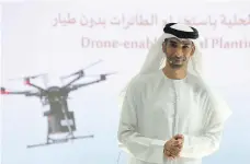  ?? Pawan Singh / The National ?? Dr Thani Al Zeyoudi, Minister of Climate Change and Environmen­t, unveils plans for mangrove-planting drones