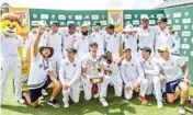  ??  ?? South African players pose with the trophy in Johannesbu­rg on Tuesday