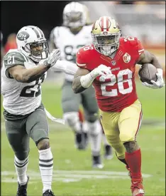  ?? BEN MARGOT / AP ?? The 49ers offense has been led by running back Carlos Hyde (28), who’s rushed for 879 yards and six TDs. He also has caught two touchdown passes.