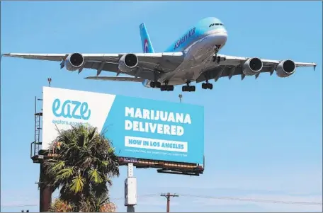  ?? Mario Tama Getty Images ?? DOZENS OF CITIES argue in a lawsuit that the state has violated Propositio­n 64 by allowing pot deliveries in cities that restrict sales.