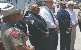  ?? DARIO LOPEZ-MILLS AP ?? Uvalde School Police Chief Pete Arredondo, third from left, has been put on leave following allegation­s that he erred in his response to a mass shooting at an elementary school that left 19 students and two teachers dead after the recent school shooting.