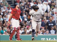  ?? Winslow Townson / Getty Images ?? The Yankees’ Rougned Odor and Red Sox catcher Kevin Plawecki watch Odor’s two-run double during the eighth inning at Fenway Park on Saturday in Boston.