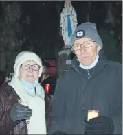  ?? Ahern) (Pic: John ?? Locals, Mossie and Breeda Buckley paying their respects, during last Friday night’s vigil for Ashling Murphy at the Mass Rock in Glenville.