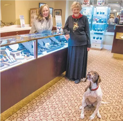  ?? ULYSSES MUNOZ/BALTIMORE SUN ?? Jean Chance, the owner and president of W. R. Chance Jewelers, is retiring and closing down her shop. It's been running for 69 years. Above are Darlene Halbritter, Chance and W.R. Chance's shop dog, Abby.