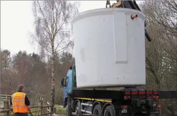  ??  ?? Carlow Concrete Tanks - Installati­on with Truck Mounted Crane.
