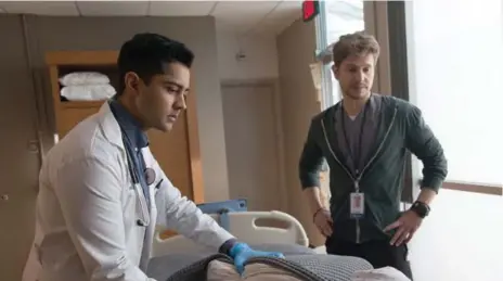  ?? GUY D’ALEMA/FOX ?? Manish Dayal, left, and Matt Czuchry star in Fox’s new series The Resident, a medical drama that leans toward the dark malice of House of Cards.