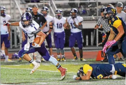  ?? SAM STEWART - DIGITAL FIRST MEDIA ?? Phoenixvil­le’s Matt Garcia breaks through the Upper Perkiomen secondary en route to a 64-yard touchdown run during the first quarter.