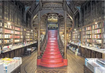  ??  ?? BELOW
Livraria Lello, a stunning Old World bookshop stocked to the rafters with new and antiquaria­n tomes in Porto, Portugal.