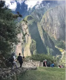  ?? CHRIS RIEMENSCHN­EIDER PHOTOS TNS ?? Steep steps are part of the challenge at the neighbouri­ng Huayna Picchu climb.